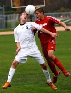 Brendan Lesch battles a Conard Chieftan for the ball in Staples' first round state tournament victory. Photo courtesy of Staplessoccer.com (Carl McNair)