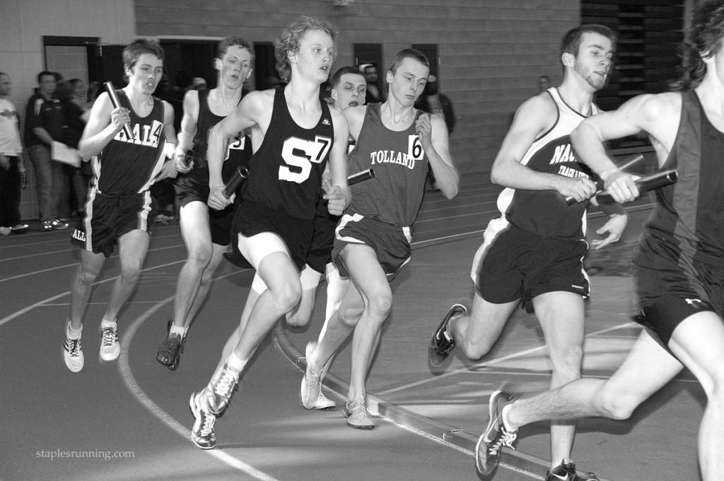 RACE+TO+THE+FINISH%3A+Varsity+runner+Walker+Marsh+%E2%80%9913+%28right%29+makes+his+way+around+the+first+bend+of+the+track+after+receiving+the+baton+from+a+teamnate.