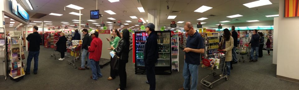 Shoppers wait for prescriptions on Sunday evening.