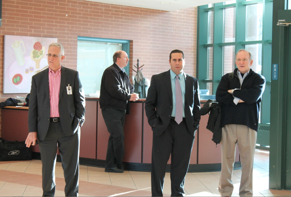 Some of the Staples administration looks on at the foyer on the day of the shooting.