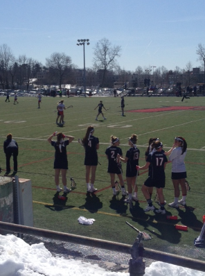 Crofts, number 2, cheers on her teammates as they play against Fairfield University.
