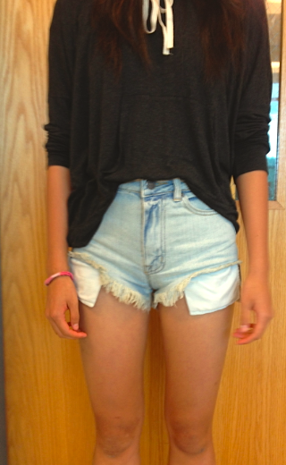 Annie Gao models the previous style as well: simple denim high waisted shorts and a comfy, loose shirt.