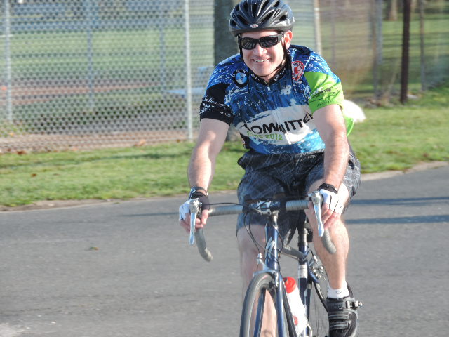 After passing his family, this man is all smiles as he makes his way to the end of the bike route. 
