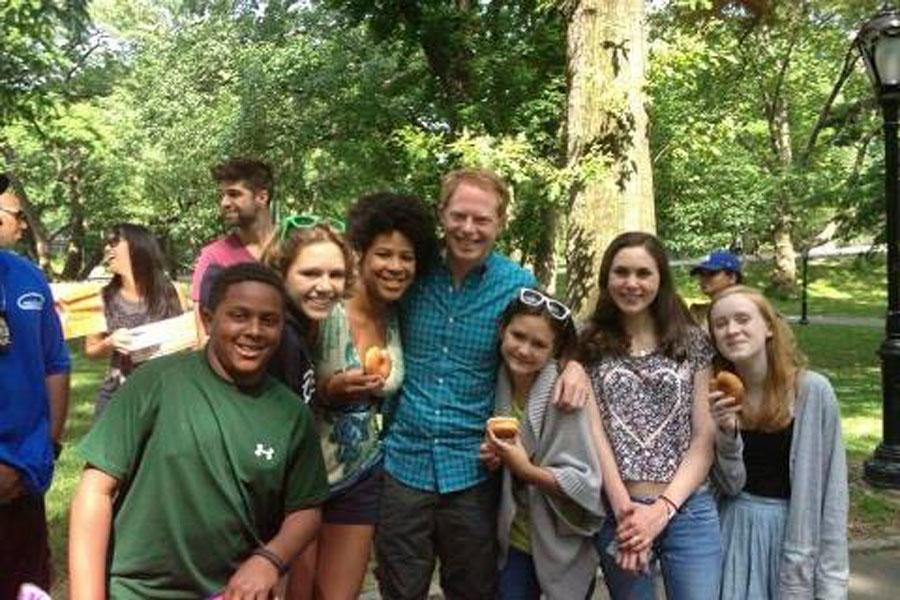 Club members pose with an actor at a Shakespeare in the Parks event this past June.  
