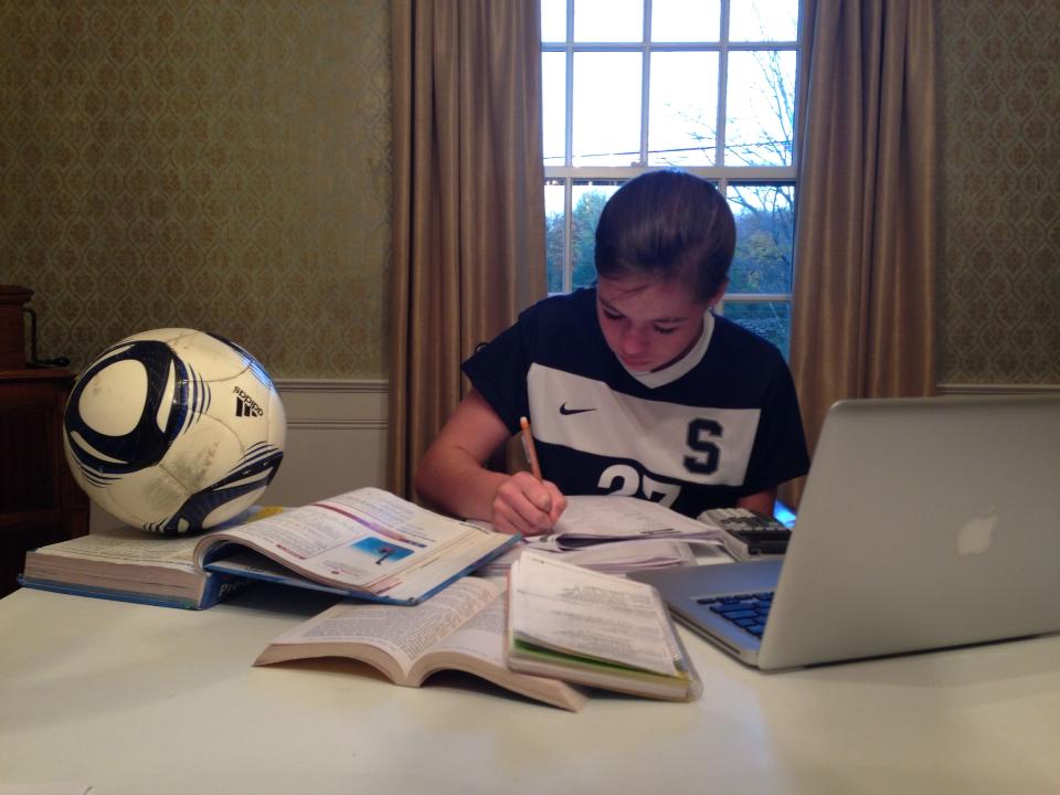 Charlotte Rossi 17 has to work efficiently on her homework after a long day of classes and soccer practice.