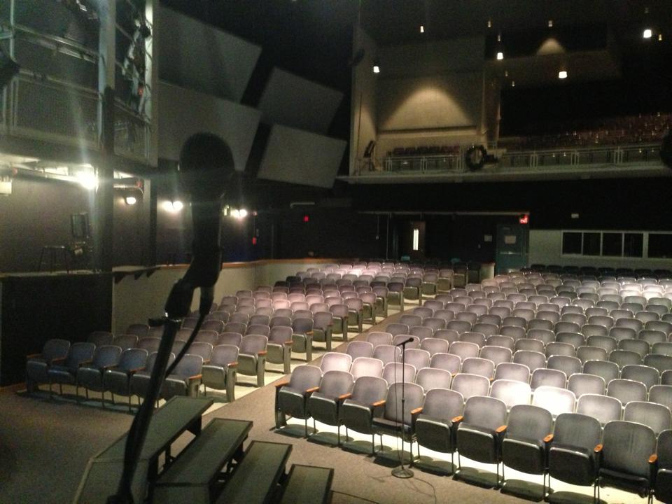 During the hiatus, the auditorium stage remains empty of actors rehearsing 