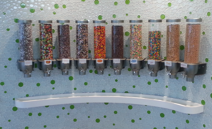 Ten of the 60+ toppings that Peachwave has to offer, featuring Reese’s Pieces and M&M’s. 