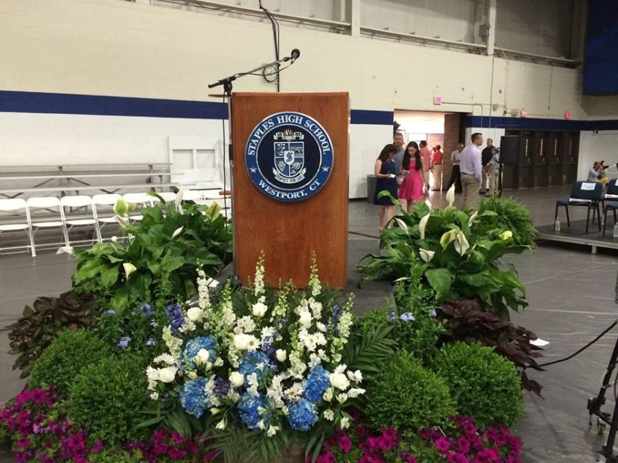 The graduation podium was decorated with the Staples High School seal as well as many flowers dyed in the classic Wrecker blue and white.

