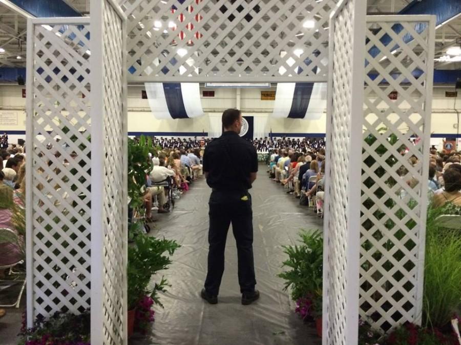 A police officer stood guard at the back of the Field House to ensure that all ceremonies remained safe for all attendees. 