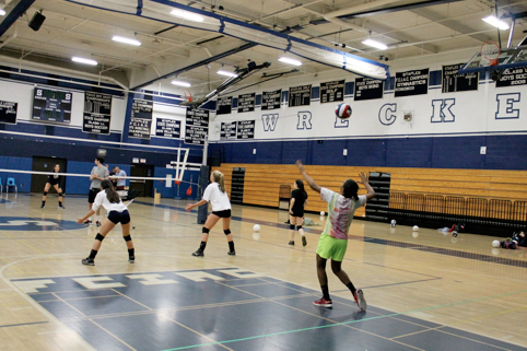 Shannon Cardoza ’15, a defensive specialist, serves the ball as her team practices in order to try and improve their third place standing in the FCIAC Central.