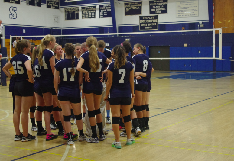 The team huddles up and listens to Coach Jonathan Shepro during a timeout. You can support the team at their next game, 10/20 at Trumbull High School. 