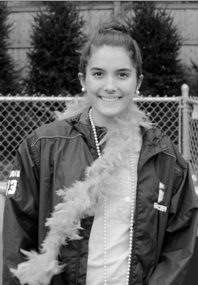 Aishah Avdiu 17, a member of the girls varsity field hocker team, sports her senior day gear.