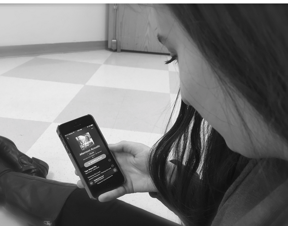 Tuning In -- Melanie Orent ’16 browses through Spotify’s Afternoon Acoustic playlist and listens to Jasmine Thompson’s acoustic version of “Thinking Out Loud,” originally sung by Ed Sheeran. 