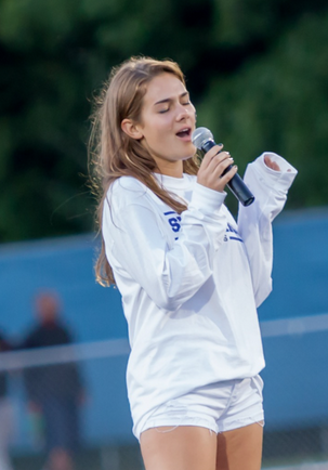 Kate Griffin ’17 singing the national anthem at Staples first home game of 2015.
