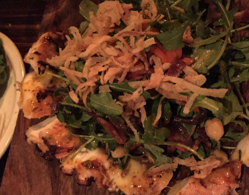 Shown above is a spicy arugula salad surrounded by a charred octopus, which is just one of the many tasty specials Bodega offers. 
