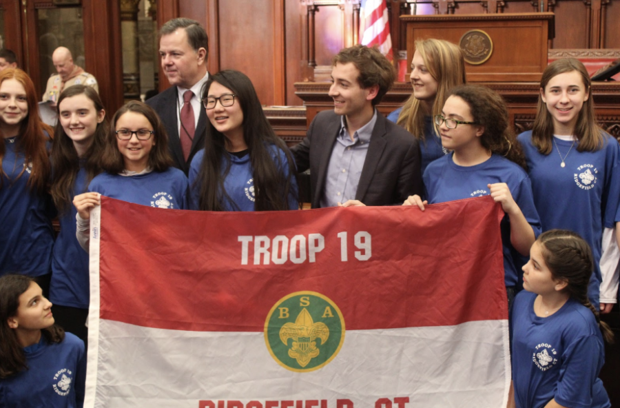State senator, Will Haskell, poses with part of Troop 19, that consists of girls officially joining Scouts of America. The new rule that went into effect Feb. 1, now allows girls between 11 and 17 to join what was formerly known as Boy Scouts of America.
