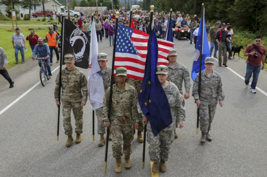 Members of the Alaska Air and Army National Guard and Alaska State Defense Force march in Klawock, Alaska. 
