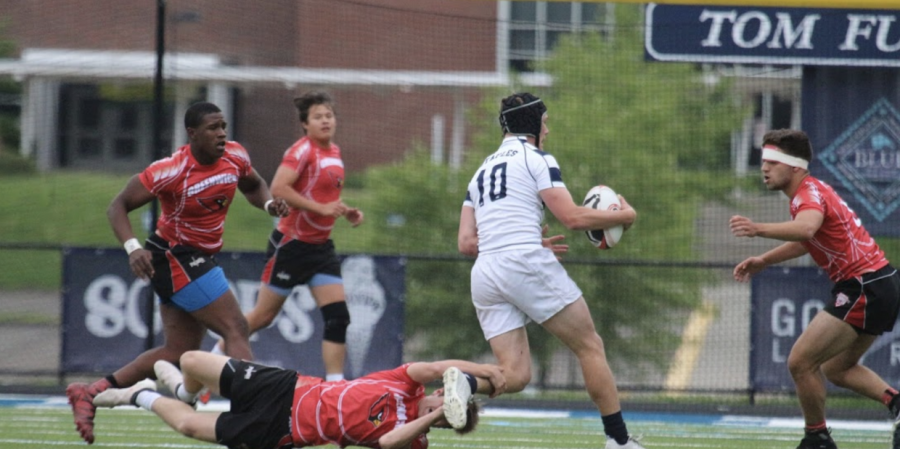 The boys’ rugby team has an offensive play during a game versus Greenwich.