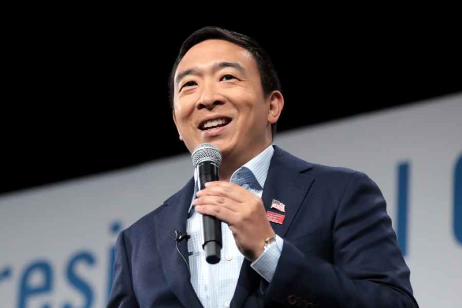 Andrew Yang addresses a crowd of supporters at a gun violence event in Des Moines, Iowa. He supports creating an effective nationwide gun licensing program, banning assault weapons and supporting the mentally ill to prevent gun violence. 