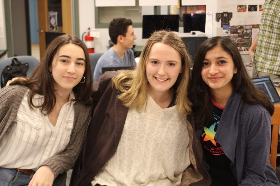 Yearbook committee members and editors Leah Chapman ’22, Zoë Kaye ’22 and Srushti Karve ’23 all work in the library classrooms to deliver yearbooks