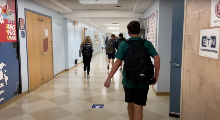 Staples students exit the cafeteria through the music hallway in the direction of the one-way hallways. Some are inevitably fated to come in late to class.