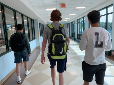 Micheal Brody ’22, Jackson Hochhauser ’22 and Noah Fraas ’22 walk to lunch. To get into the cafeteria, students need to walk around in the hallway outside of the cafe and use the back entrance to ensure social distancing. 