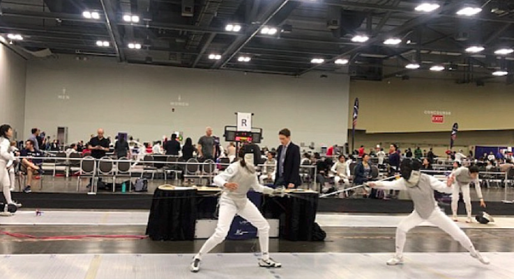 Photo of Anna Pan  ’22 fencing for her club team. She is one of the four staples students to bring fencing to staples. 