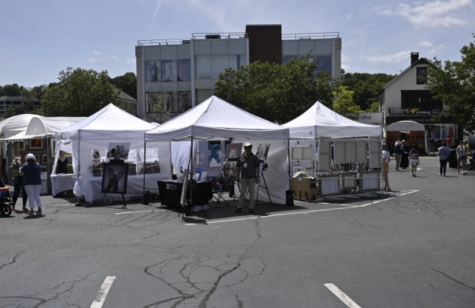 Kate Smith ’22, in her internship,  helps prepare for the Memorial Day Westport Fine Arts Fair. This opportunity allowed her to get real world experience with business negotiations and event planning. 