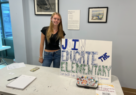 Kaya Law ’24 runs Anya Nair’s ’24 Educate the Elementary club stand. This club had over five pages of students eager to sign up.