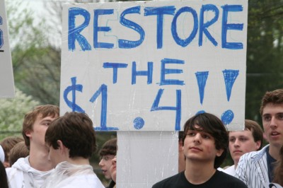A picket sign reads "Restore the $1.4," a phrase that students began to chant throughout the rally. Photo by Stevie Klein '12.