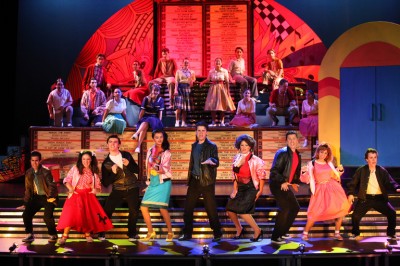 Local student thespians, some of them current and former Staples Players, perform a musical number from “Grease,” this summer’s production. | Photo by Kerry Long