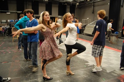 Shannon Walsh '10 and Annabel Burchill '12 practice a dance routine for the show, full of famous musical numbers. | Photo by Caley Beretta '10