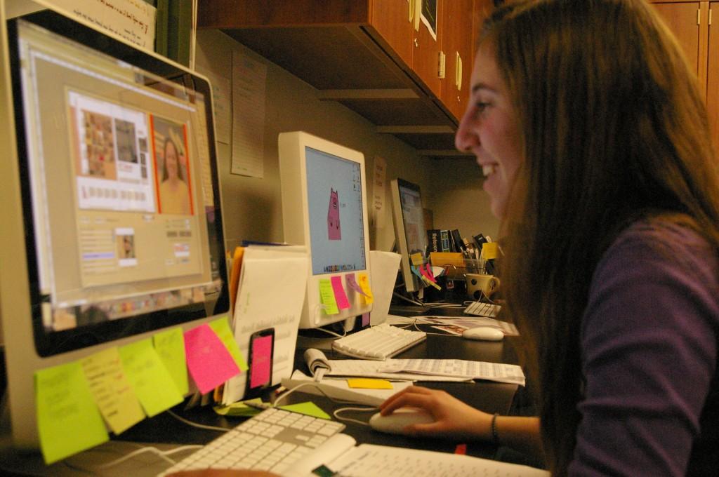 CHRONICLING MEMORIES: Jen Abrams ’11, along with the rest of the yearbook staff around her, crafts pages in the yearbook. The staff meets after school every day to take photos and compile a year’s worth of information. | Photo by Lila Epstein 10