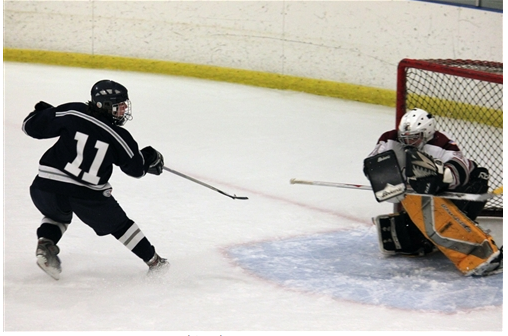 Forrest Savage (Weston High School) takes a shot on goal. | Photo courtesy of www.stapleshockey.com (Anna Andriuk)