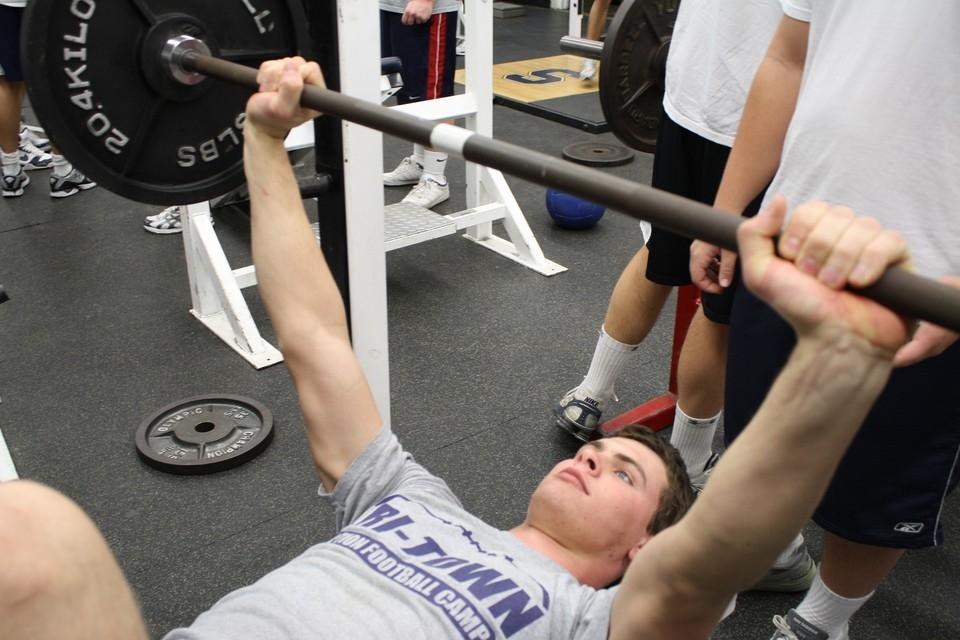 POWER LIFT: Captain Chris Coyne ’11 reps weights on the bench press while training hard in the off-season. Coyne returns to the Wreckers as an All-FCIAC Defensive-End and runner up in total sacks in Connecticut. | Photo by Lucas Hammerman 10 