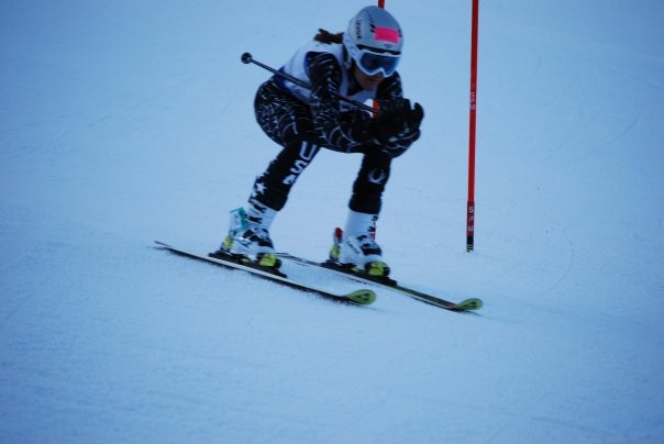 FLYING BY: Melissa Sweeney ’11 shreads up the slopes in a  recent CIAC race. She has been a top performer for the  ski team since her arrival at Staples. | Photo by Barbra Sweeney 