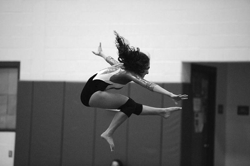 STICK IT: Emily Fishman ’12 finishes her bar routine at the CIAC State Championship. The team later placed sixth at the competition with a team score of 119 points. “I am happy with the way the season went, we did a lot better than we thought we would,” Captain Kara Tricarico ’11 said.