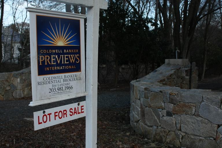 One of the many for sale signs in Westport, which, despite selling fewer units, has weathered the real estate slump better than other towns.  | Photo by Mel Mignucci 12