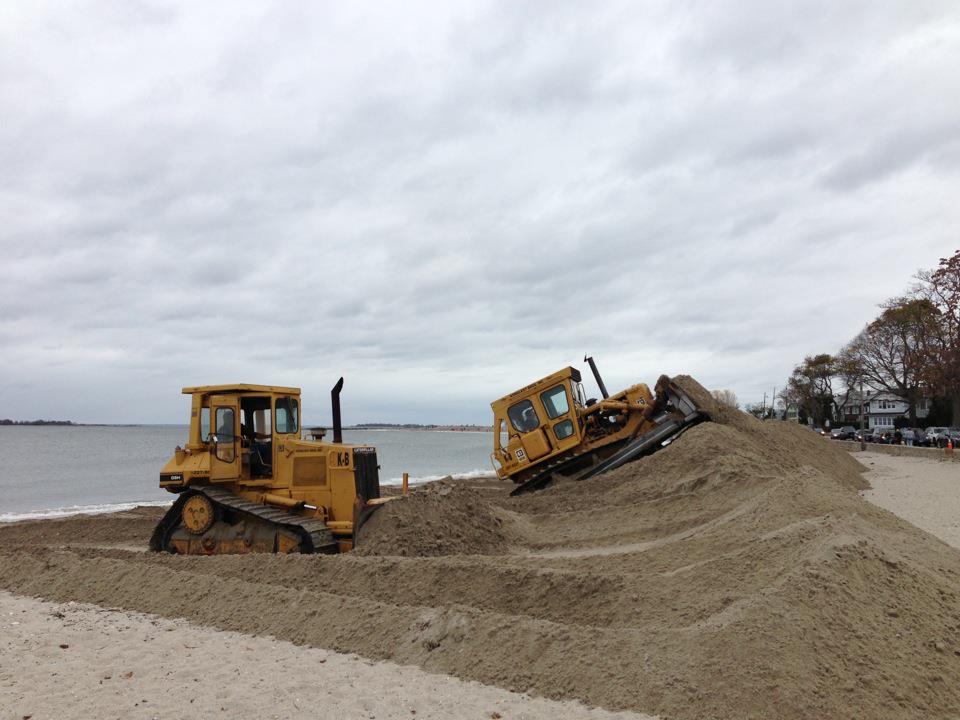 Tractors+create+a+sand+barricade+along+Compo+Beach