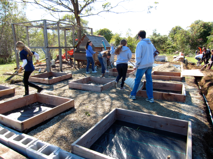A glimpse into the Oct. 13 project to commemorate 20 years of Builders Beyond Borders at Wakeman Town Farm.