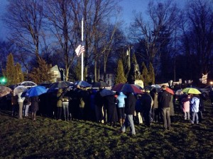 Even in the rain, people pay their respects to the victims of the Sandy Hook shootings