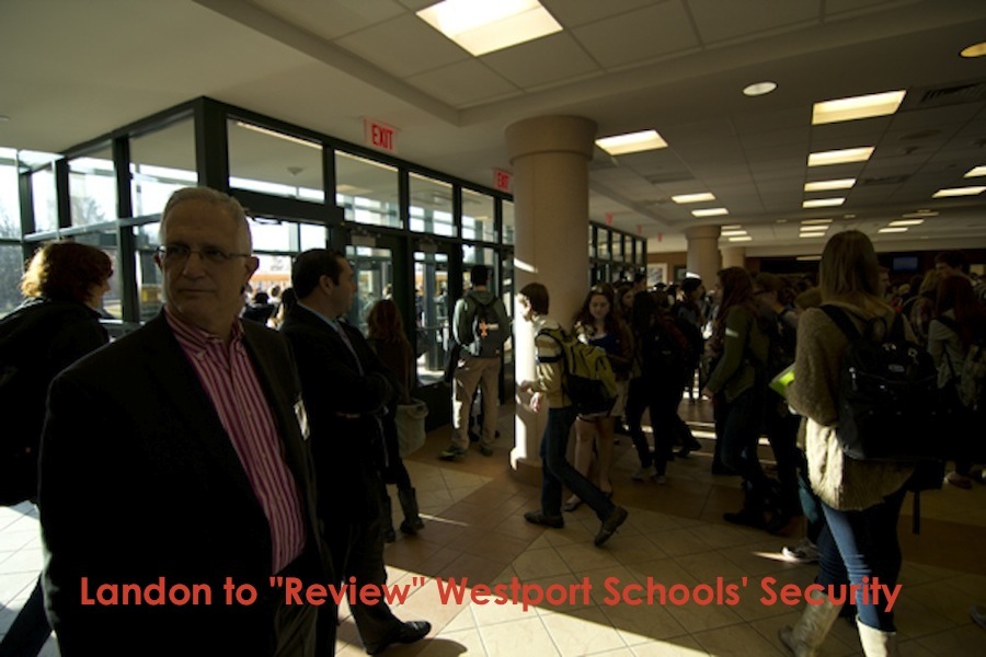 Dodig watches over students as they flood through the lobby on their way to class.