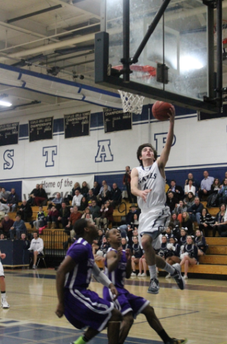 Senior James Frusciante goes up for the lay-up against West Hill.