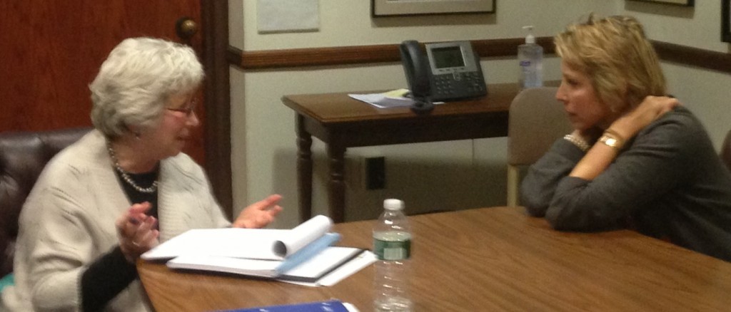 Velma Heller (left) and Clarissa Moore (right) discuss the education budget.