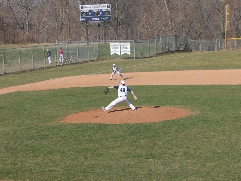 Junior Robert Vallone at the mound, in action against McMahon