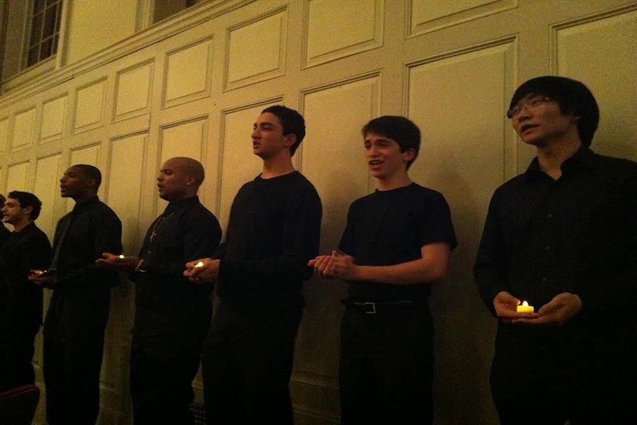 Orphenians members Thomas Bonner ‘14 and Ian Goodman ‘15 sing amidst the Norwalk Community College Choir.