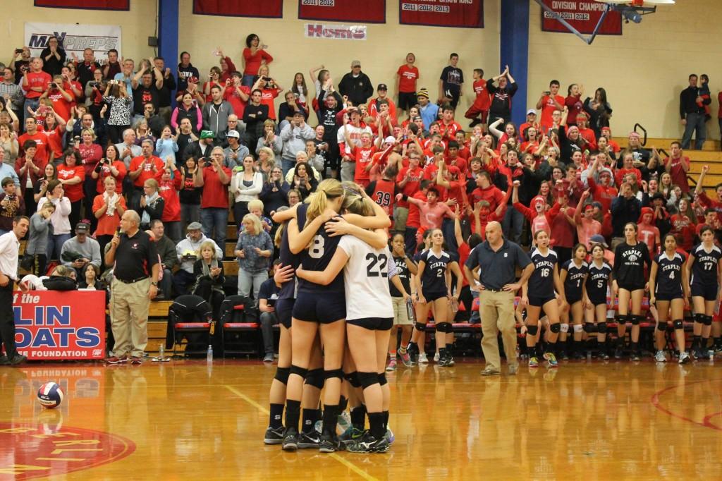 The+girls+huddle+in+after+the+final+game+point.