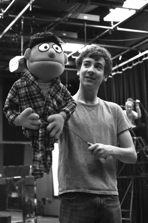 Will Haskell ’14, playing the character Princeton in the Staples’ production, practices his puppeteering with professional puppeteers Pam Arciero and Rick Lyon. 
