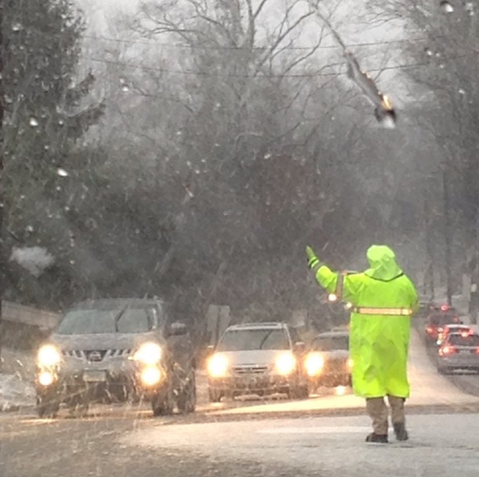 Snow falls as students and teachers make their way to school on March 31, a day that typically doesnt bring snow showers.