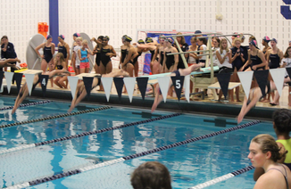 Staples Girls swim and dive sets records in season opener